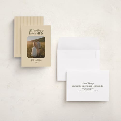 This is a ivory petite holiday cards with standard by Ana de Sousa called just married & merry printing on signature in petite
