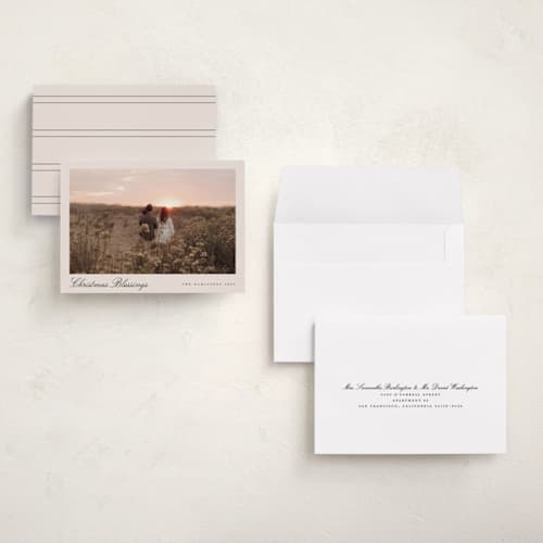 This is a tan petite holiday cards with standard by Nicole Walsh called pano script printing on signature in petite