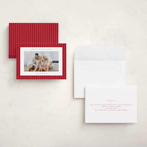 This is a poinsettia petite holiday cards with standard by Wildfield Paper Co called poinsettia stripe printing on signature in petite