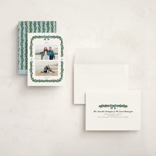 This is a garland petite holiday cards with standard by Claudia Orengo called mistletoe printing on signature in petite