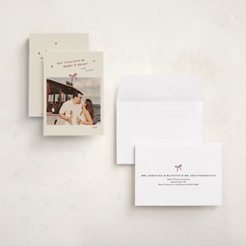 This is a cinnamon petite holiday cards with standard by Ani Somi called merry little bow printing on signature in petite