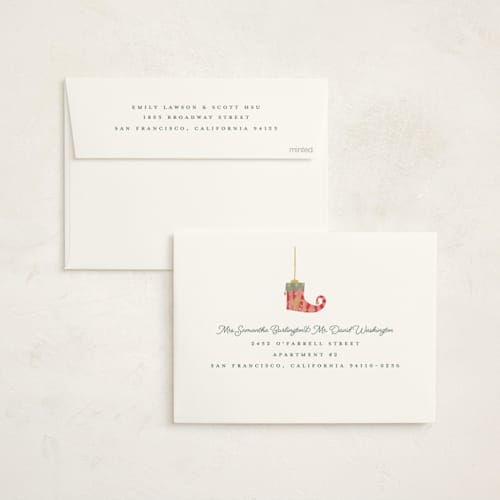 This is a champagne foil pressed holiday cards with foil pressed by Teju Reval called fun ornaments printing on signature in standard