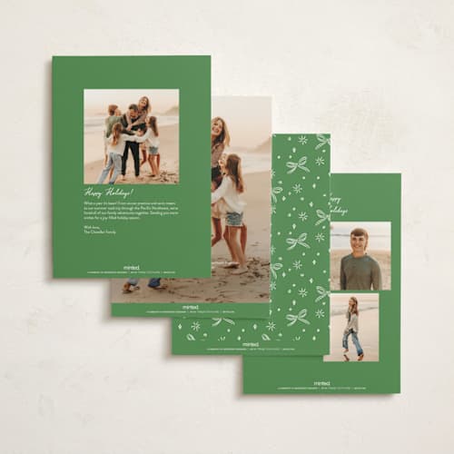 This is a cosmo foil pressed holiday cards with foil pressed by Erin German called festive spirit printing on signature in standard
