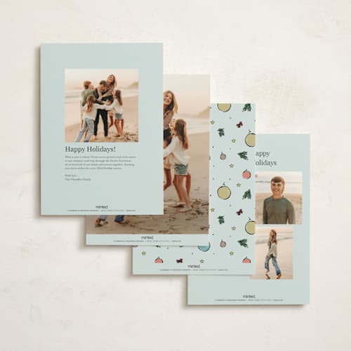 This is a frosted blue non photo holiday cards with standard by Cass Loh called ornament tree printing on signature in standard
