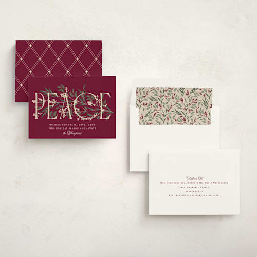 This is a holly berry non photo holiday cards with standard by Robert and Stella called entwined peace printing on signature in standard