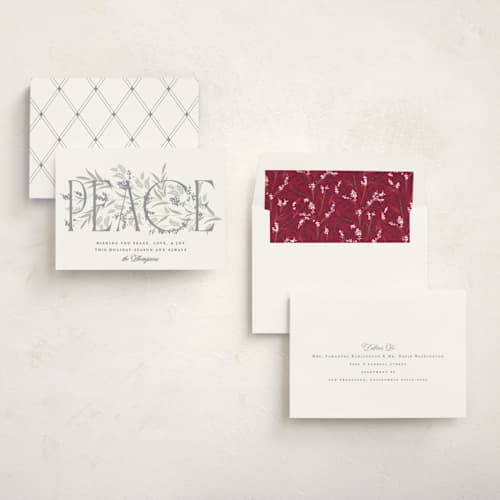 This is a snow non photo holiday cards with standard by Robert and Stella called entwined peace printing on signature in standard