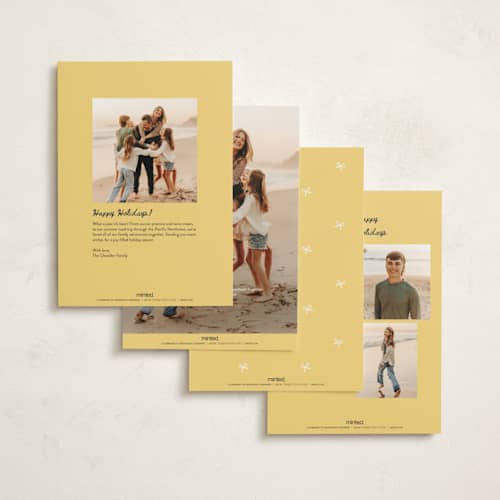 This is a champagne non photo holiday cards with standard by Kamala Nahas called cheers printing on signature in standard