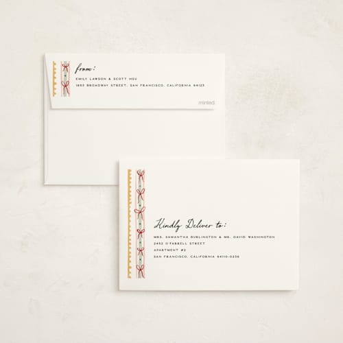 This is a butter non photo holiday cards with standard by Pixel and Hank called joy ribbon printing on signature in standard