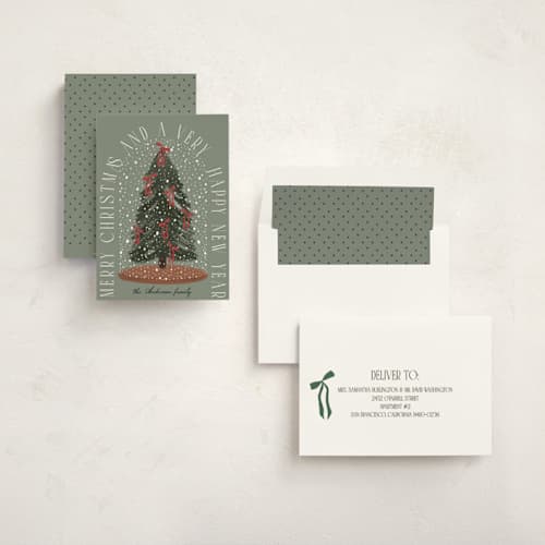 This is a pine non photo holiday cards with standard by Maja Cunningham called snowglobe printing on signature in standard