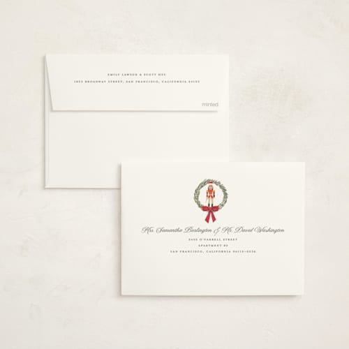 This is a berry non photo holiday cards with standard by Teju Reval called nutcracker wreath printing on signature in standard