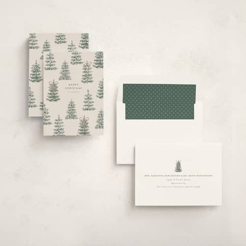 This is a champagne non photo holiday cards with standard by Angela Garrick called festive forest printing on signature in standard