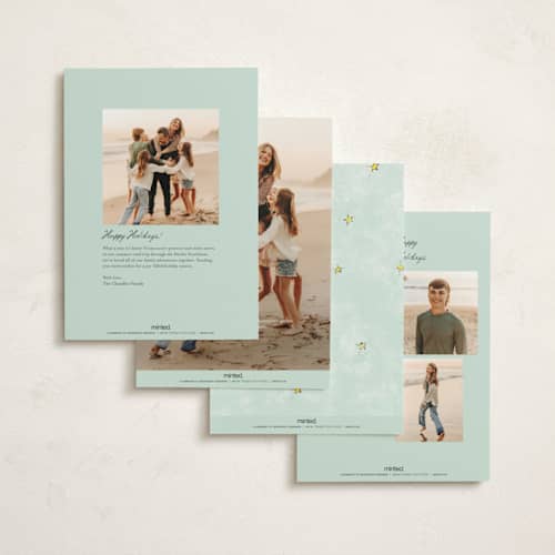 This is a winter rose non photo holiday cards with standard by Cass Loh called evergreen magic printing on signature in standard