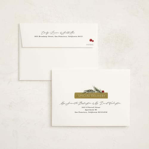 This is a holly jolly non photo holiday cards with standard by Kate Ahn called book stack printing on signature in standard