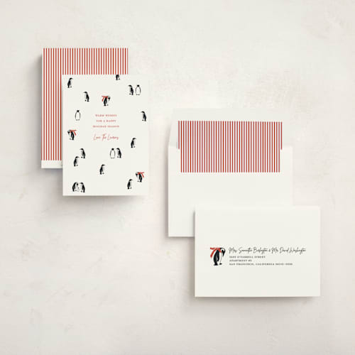 This is a candy cane non photo holiday cards with standard by Lauren Jinhee called march of the penguins printing on signature in standard