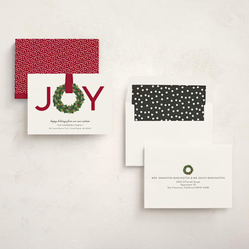 This is a cranberry non photo holiday cards with standard by Sarah Brown called joy wreath printing on signature in standard