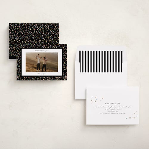 This is a popped new year photo cards with standard by Pixel and Hank called confetti and sparkle printing on recycled smooth signature in standard