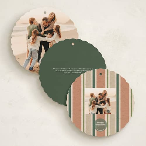 This is a pine needle holiday card ornaments with standard by Erin German called botanical wreath printing on signature in ornament
