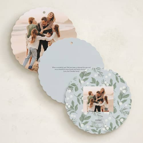 This is a ice holiday card ornaments with standard by Everett Paper Goods called dove wreath printing on signature in ornament