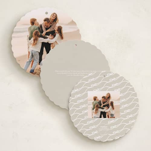 This is a snow holiday card ornaments with standard by Kaydi Bishop called bow tied printing on recycled smooth signature in ornament