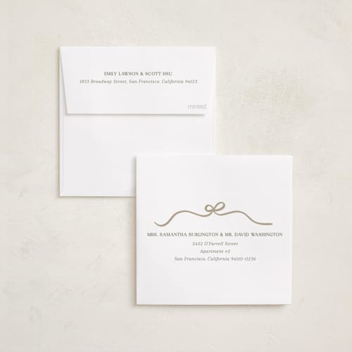 This is a snow holiday card ornaments with standard by Kaydi Bishop called bow tied printing on recycled smooth signature in ornament