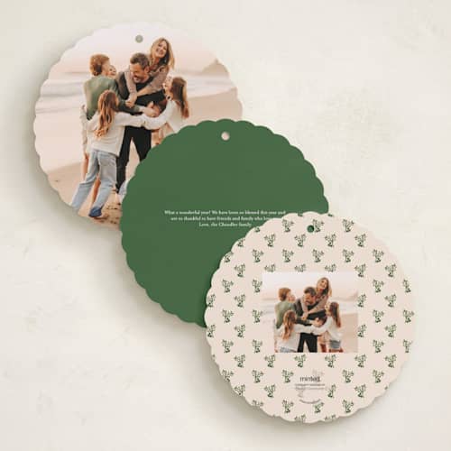 This is a fir holiday card ornaments with standard by Teju Reval called scalloped holly printing on recycled smooth signature in ornament