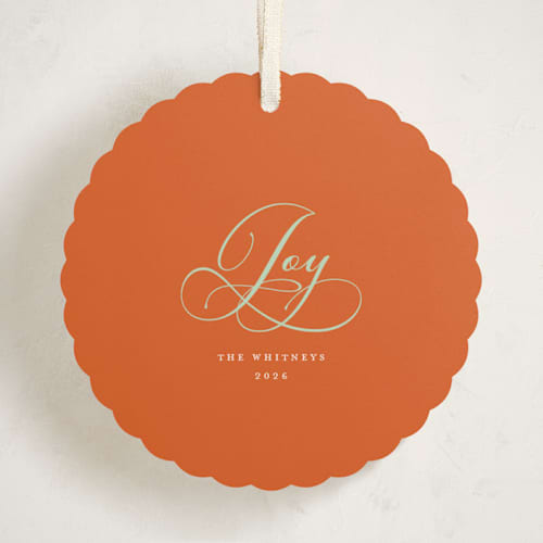 This is a tangerine holiday card ornaments with standard by Erika Firm called joy cloud printing on signature in ornament