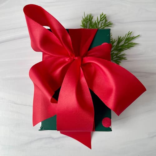 This is a red holiday decorations by Honey Silks Co called 2'' holly red holiday ribbon - 5 yards in standard