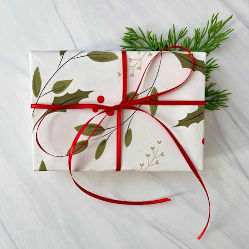 This is a red holiday decorations by Honey Silks Co called red holiday ribbon 1/8" x 10 yards in standard