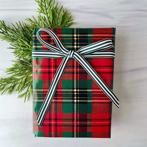 This is a green holiday decorations by Honey Silks Co called forest green stripe 3/8" x 15 feet holiday ribbon in standard