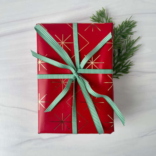 This is a green holiday decorations by Honey Silks Co called 1/4" x 15 feet - green vertical stripe holiday ribbon in standard
