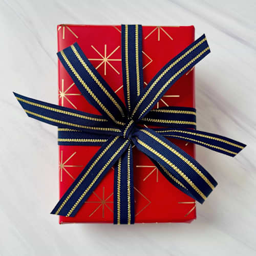 This is a gold holiday decorations by Honey Silks Co called navy and gold stripe holiday ribbon 5/8" x 15 feet in standard