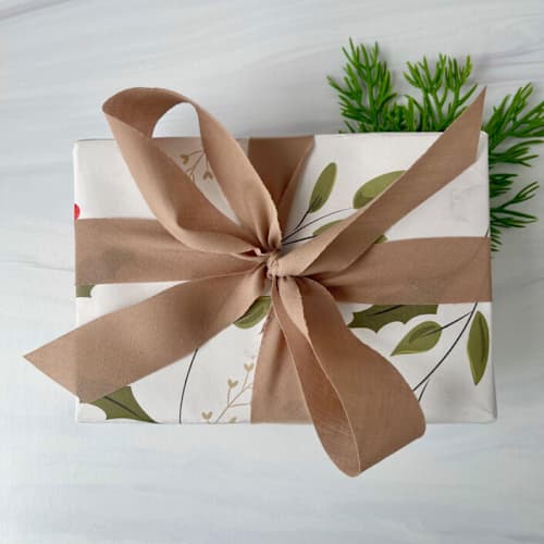 This is a brown holiday decorations by Honey Silks Co called 1” x 15 feet - warm cocoa holiday ribbon in standard