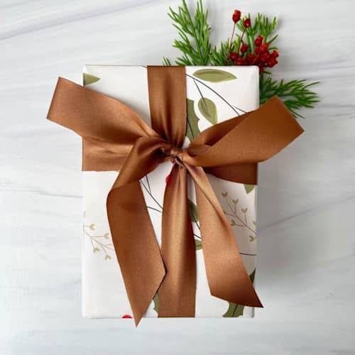 This is a brown holiday decorations by Honey Silks Co called 1'' copper holiday ribbon - 5 yards in standard