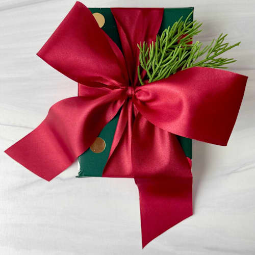 This is a red holiday decorations by Honey Silks Co called 2” dark red holiday ribbon - 5 yards in standard
