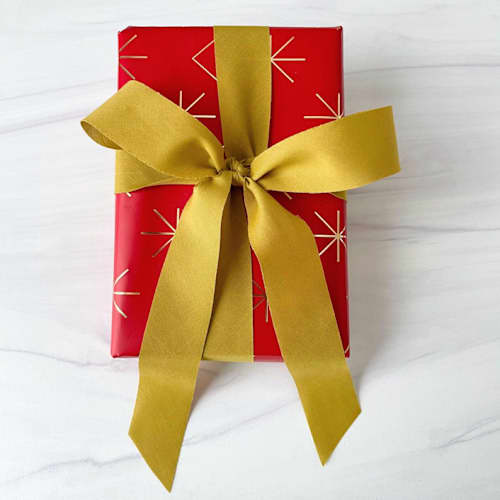 This is a green holiday decorations by Honey Silks Co called deep golden pear holiday ribbon 1" x 15ft in standard