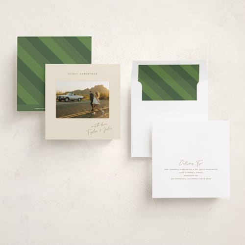 This is a latte foil pressed holiday cards with foil pressed by Kamala Nahas called merry slide printing on recycled smooth signature in square
