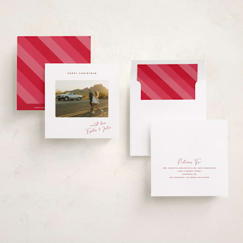 This is a cherry foil pressed holiday cards with foil pressed by Kamala Nahas called merry slide printing on recycled smooth signature in square
