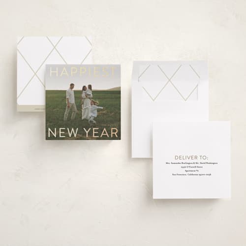 This is a champagne foil pressed holiday cards with foil pressed by Angela Thompson called gilded type printing on recycled smooth signature in square