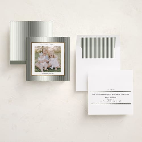 This is a sage green foil pressed holiday cards with foil pressed by Lucrecia Caporale called striped frame printing on recycled smooth signature in square