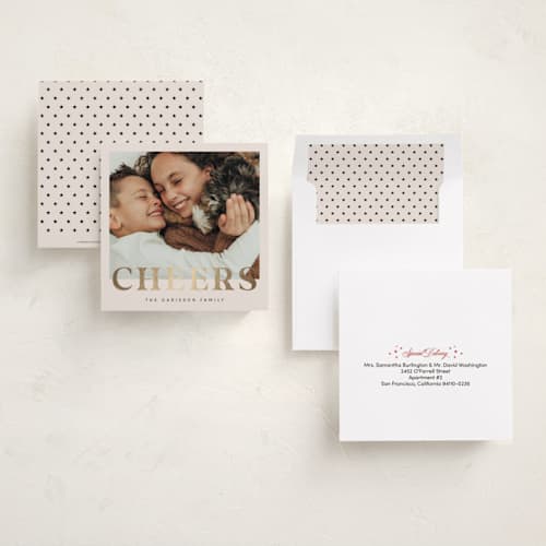 This is a champagne foil pressed holiday cards with foil pressed by Ilene Guy called ny cheers printing on recycled smooth signature in square