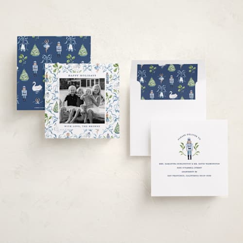 This is a blue ribbon holiday photo cards with standard by Sarah Knight called nutcracker ribbons printing on recycled smooth signature in square