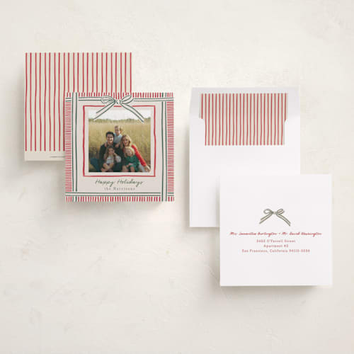 This is a ruby holiday photo cards with standard by Chris Griffith called holiday wrap printing on recycled smooth signature in square