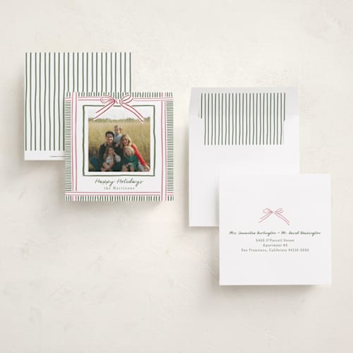 This is a pink sand holiday photo cards with standard by Chris Griffith called holiday wrap printing on recycled smooth signature in square