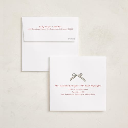This is a ruby holiday photo cards with standard by Chris Griffith called holiday wrap printing on recycled smooth signature in square