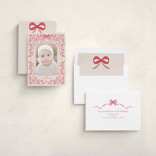 This is a poinsettia holiday photo cards with standard by Anne Ciotola called one red bow printing on recycled smooth signature in standard
