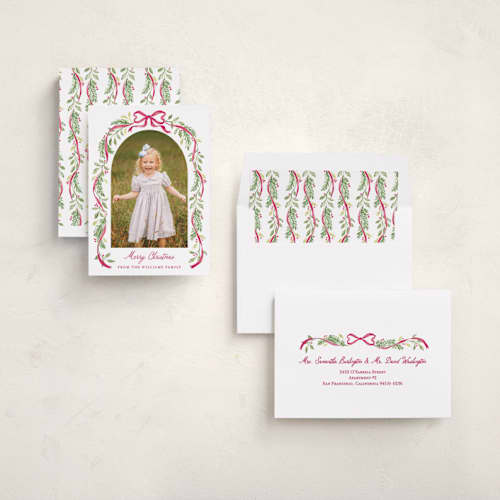 This is a berry holiday photo cards with standard by Sarah Knight called ribbon arch printing on recycled smooth signature in standard