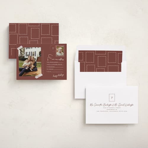 This is a maroon holiday photo cards with standard by Gwen Bedat called return address printing on recycled smooth signature in standard