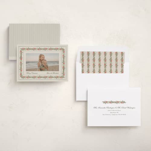 This is a vanilla holiday photo cards with standard by lori jacobs wemple called merry frame greenery printing on recycled smooth signature in standard