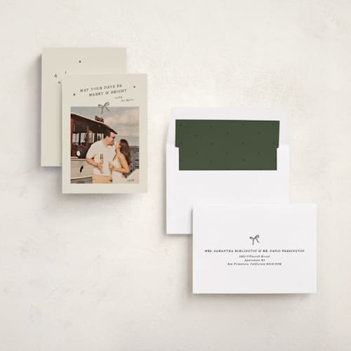 This is a glade holiday photo cards with standard by Ani Somi called merry little bow printing on recycled smooth signature in standard