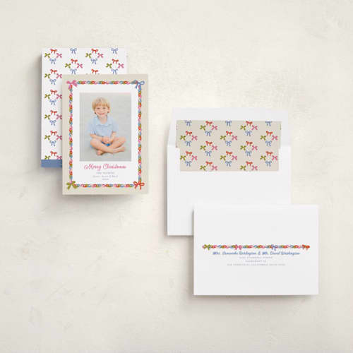 This is a buttercream holiday photo cards with standard by Erika Firm called paperchain border printing on recycled smooth signature in standard